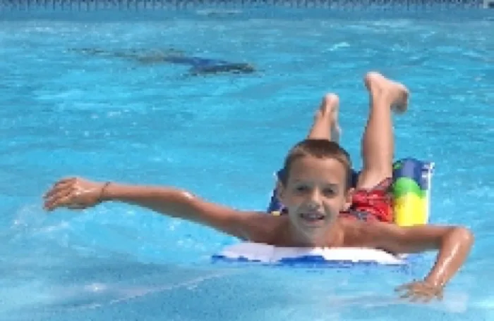 Child enjoying a Coastal Pools swimming pool