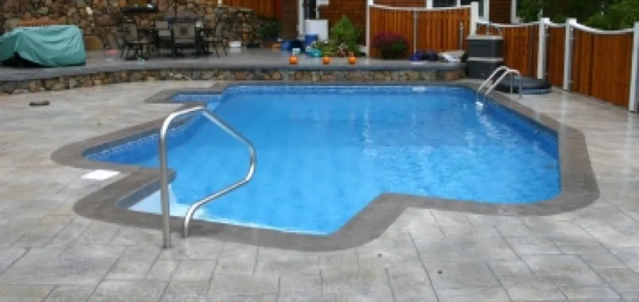 Custom vinyl-lined in-ground pool installed by Coastal Pools
