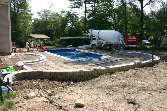 Finished paver patio around a fiberglass pool